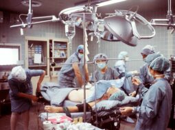 Medical team performing a surgical procedure in an operating room, showing advanced healthcare technology and patient care.